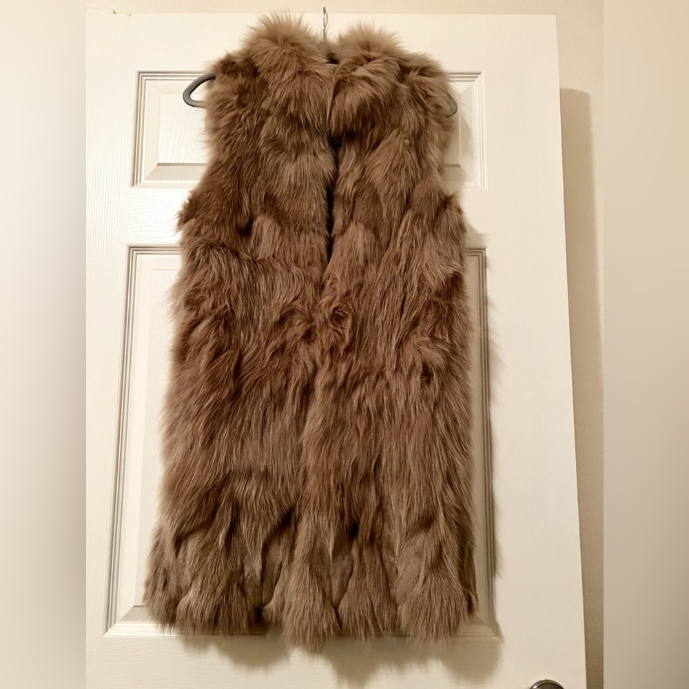 Real fur long vest. Very soft and looks like new. I’m open for offers.